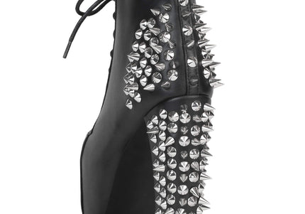Black high-heeled boot with silver spikes on a white background